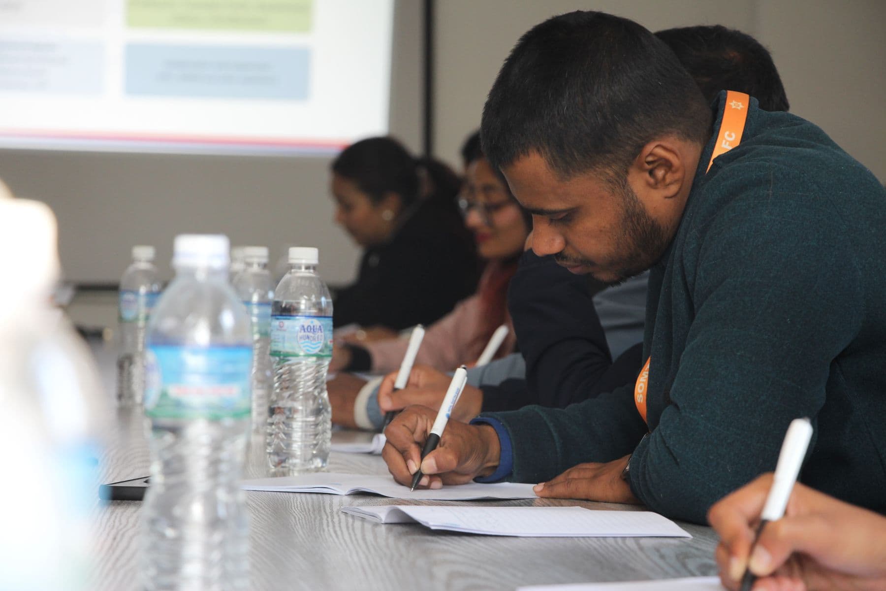 Adult learners completing a focused workshop task